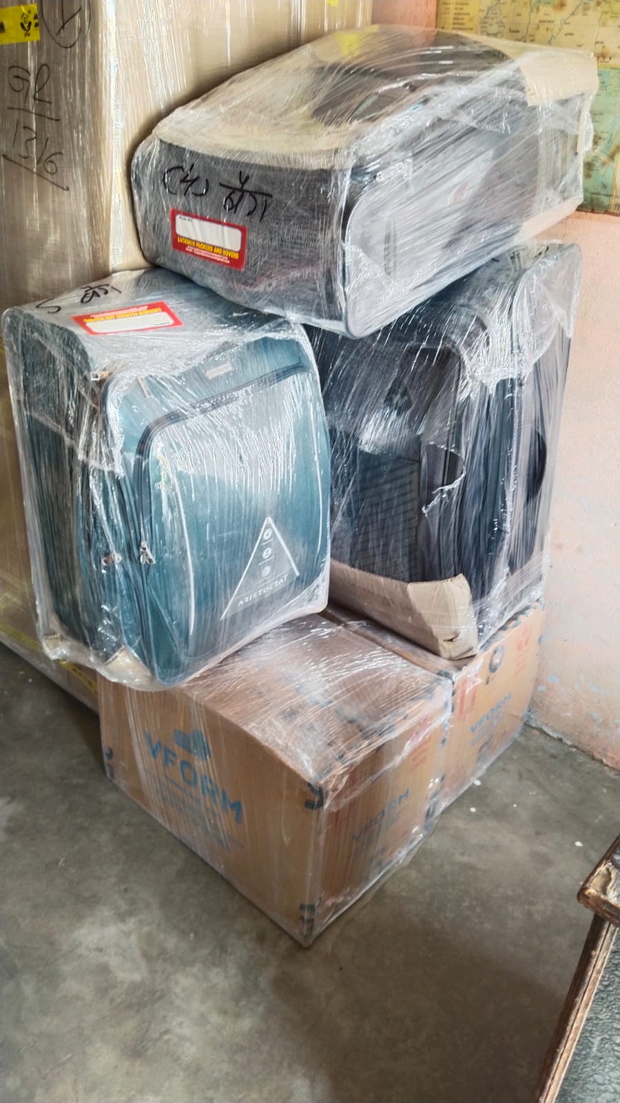 Trolley bags and boxes shrink wrapped for safety