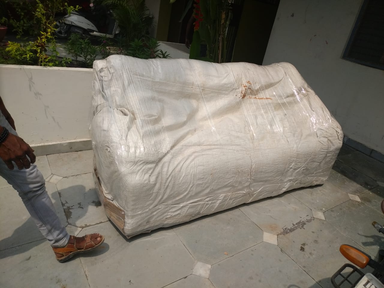Outstation Sofa Packing wrapped in heavy duty sack